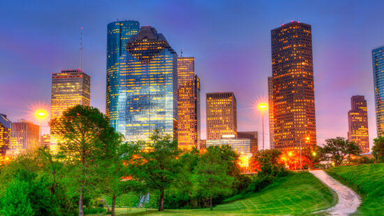 Houston Texas modern skyline at sunset twilight on park